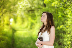 graphicstock beautiful woman with bible is in sunny nature HAQvNpQjZZ thumb