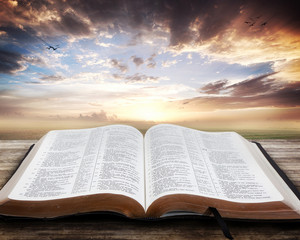 open bible with beautiful sunset rmXx3Wyfe0 thumb 1