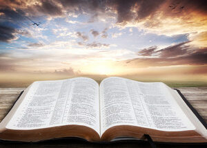 open bible with beautiful sunset rmXx3Wyfe0 thumb