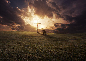 a man kneeling at a cross at sunset rXUS30WlR thumb