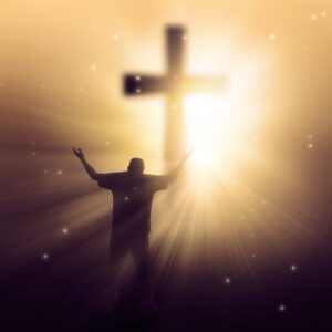 a man walking towards a cross with sunbeams BmfhpCZgA