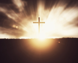 christian cross at sunset on grass field background rXIlARWeA thumb