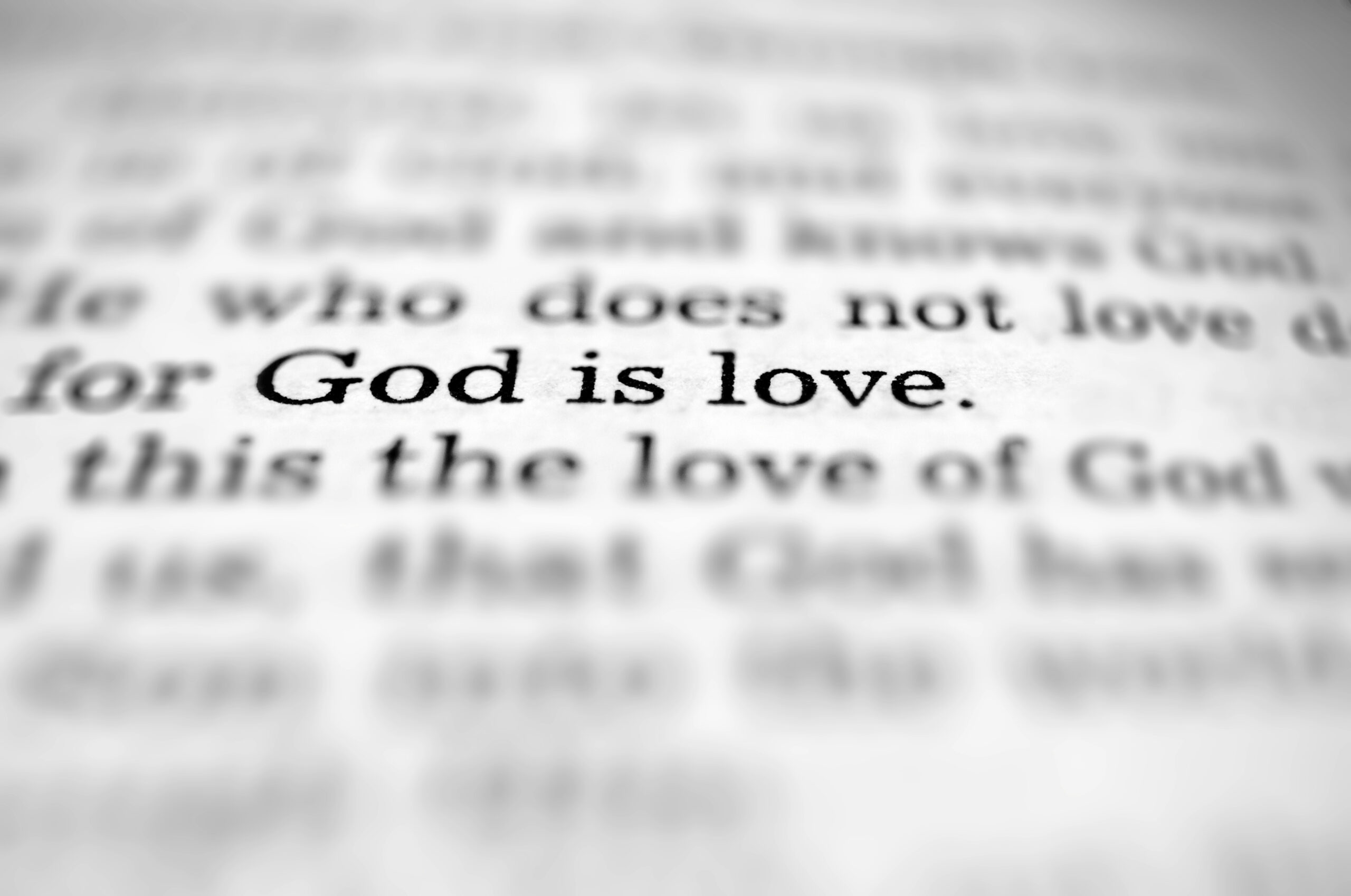 close up on the pages of the bible that says god is love SQOtxJGeC scaled