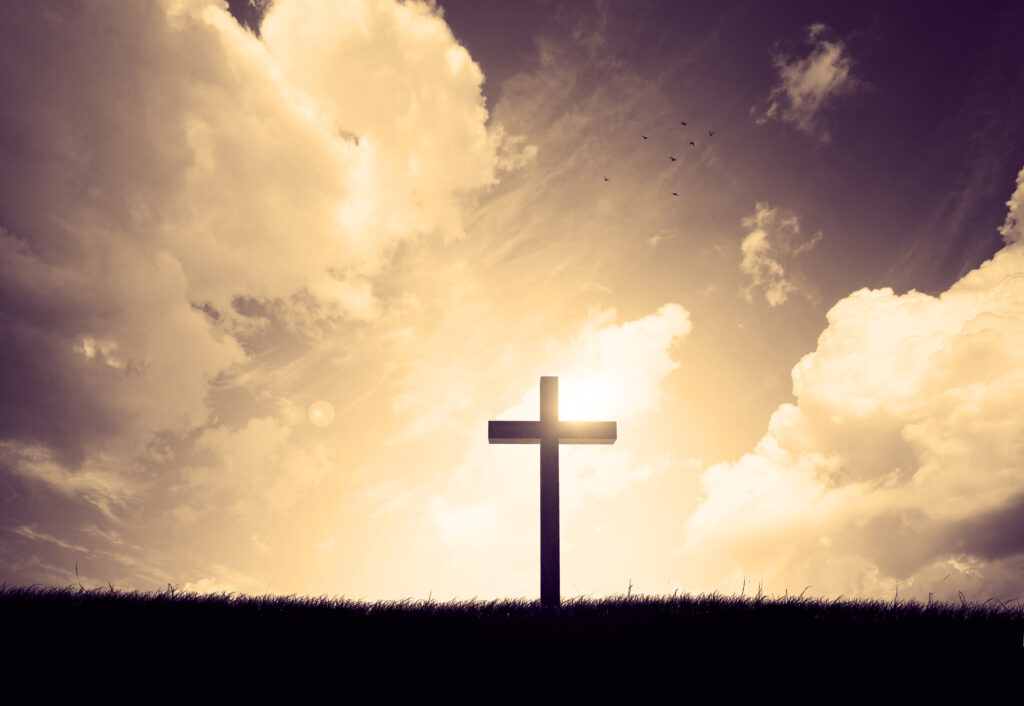 cross on a hillside with sunset in the background SsQxr2FLDl