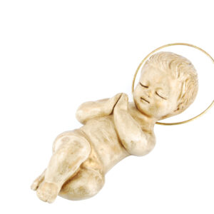 golden baby jesus lying on white QJ4lVE