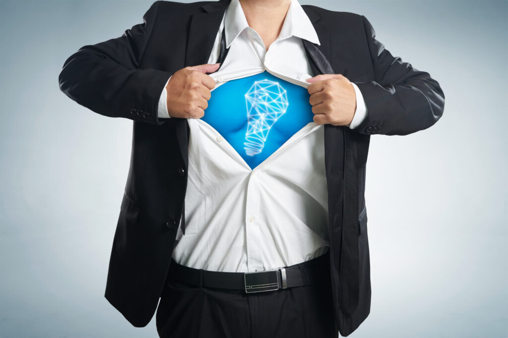 graphicstock businessman ripping off shirt and idea light bulb appears on his chest concept on background SdVmk3vlil