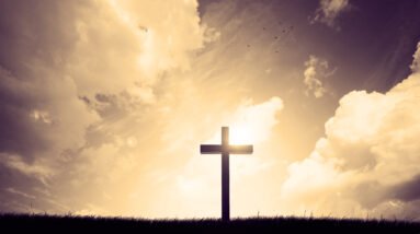 cross on a hillside with sunset in the background SsQxr2FLDl