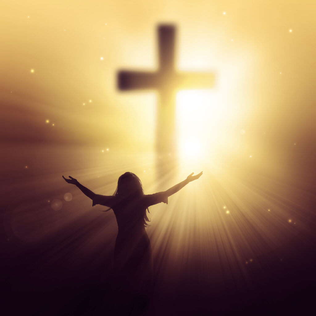 a man walking towards a cross with sunbeams HmbcR0Zx0