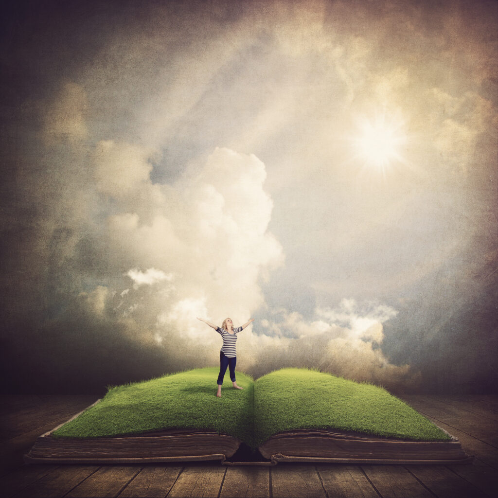 a woman stands on the pages of the bible and worships SQW5kkGeA
