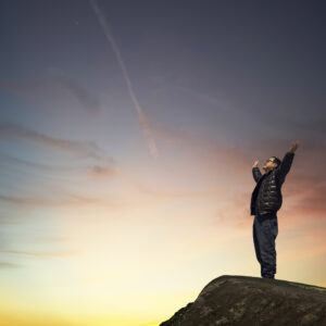 graphicstock man with hands raised in the sunset concept for religion worship prayer and praise rOYlFYiPgsl