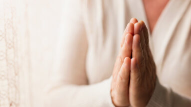 graphicstock hands of an unrecognizable woman in white cardigan praying r0xJrwQ6 Z