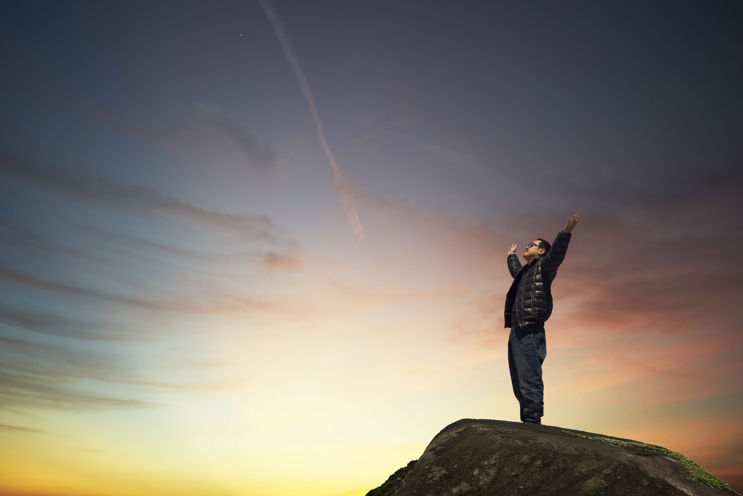 graphicstock man with hands raised in the sunset concept for religion worship prayer and praise rOYlFYiPgsl scaled